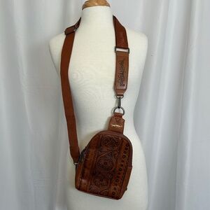 TRINITY RANCH FLORAL TOOLED SLING BAG